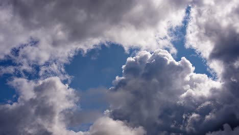 Wide-timelapse-shot-of-a-blue-sky-with-large-white-clouds