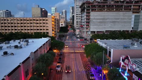 Aerial-flyover-illuminated-street-with-traffic-on-Downtown-of-Fort-Lauderdale