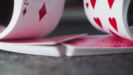 A-close-up-view-of-hands-shuffling-a-deck-of-cards,-setting-the-stage-for-a-game-of-chance-and-excitement