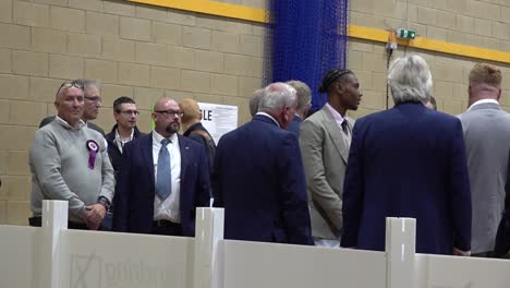 Labour-candidate-Jovan-Owusu-Nepaul-waits-with-Conservative-MP-Giles-Watling-to-hear-the-results-of-the-general-election-in-Clacton,-Essex,-UK