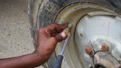 Close-up-shot-of-filling-air-in-the-tractor-tyre