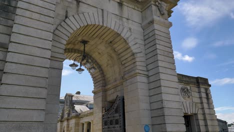 Cars-exiting-the-entrance-to-the-Royal-William-Yard-in-Plymouth,-Devon-UK,-July-2024