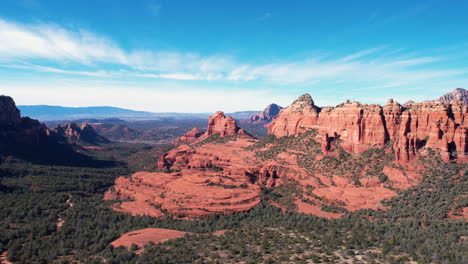 Aerial-View-of-Picturesque-Landscape-Around-Sedona,-Arizona-USA,-Red-Rock-Hills-and-Green-Valley