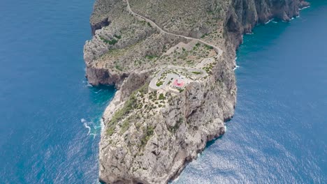 Scenic-aerial-view-of-Formentor-Lighthouse-on-rugged-limestone-cliff,-Spain