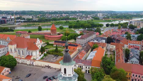 Medieval-Kaunas-castle-and-Kaunas-Priest-Seminary-towards-Nemunas-river,-Kaunas,-Lithuania