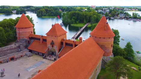 Closer-aerial-view-of-the-Trakai-castle-entrance-at-Galve-lake,-Vilnius,-Lithuania