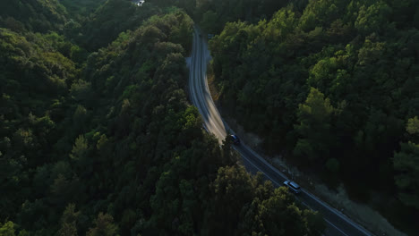 Aerial-tilt-shot-following-traffic-in-the-mountains-of-Istria,-sunset-in-Croatia