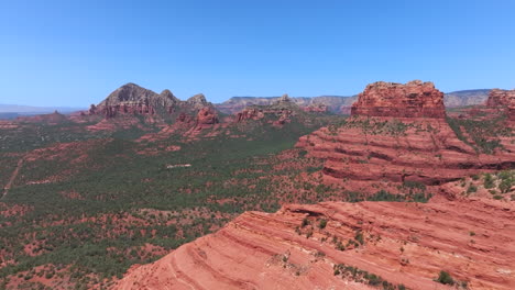 Camera-flies-through-lunar-like-rock-formations-in-Sedona,-AZ