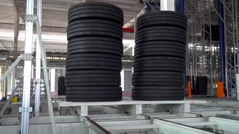 Automated-science-mechanical-tire-production-technology-view-at-modern-industrial-factory-closeup-real-shot