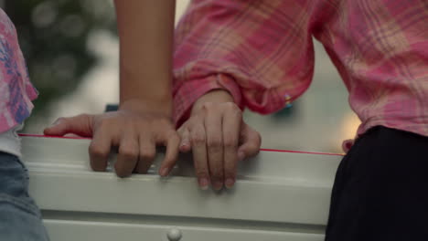 Love-romance-close-up-couple-hands-sweet-touching-while-traveling-on-open-air-bus