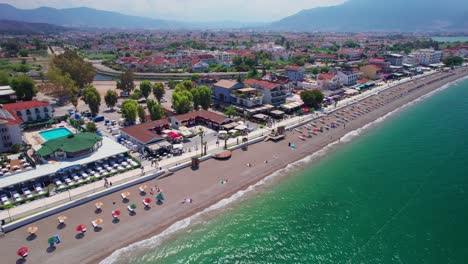 Aerial-of-Shops-and-Restaurants-on-Calis-Beach,-Fethiye,-Turkey