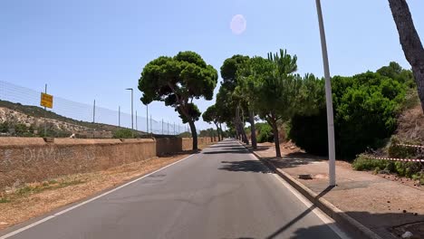 Point-of-view,-sunlight-journey,-picturesque-Italian-highway,-Cagliari