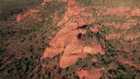 Drone-orbits-around-lunar-like-rock-formation-in-Sedona,-Arizona