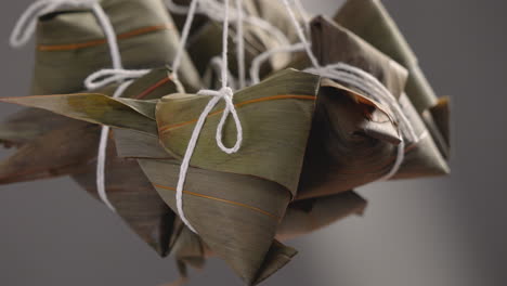 Making-zongzi-food---preparing-and-wrapping-Chinese-rice-dumpling.