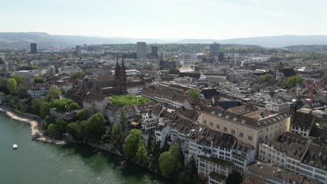 Old-town-Basel-city,-Switzerland,-Rhine-river-in-central-Europe,-aerial-drone