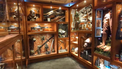 Inside-view-of-small-museum-within-Weta-Cave-full-with-film-models-and-artefacts-from-Lord-of-the-Rings,-and-Planet-of-the-Apes-in-Wellington,-New-Zealand-Aotearoa