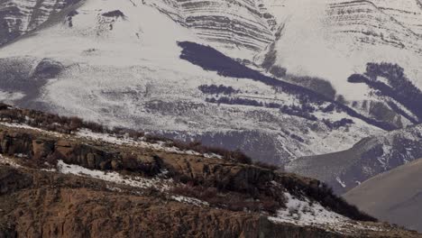 Tilt-up-of-Patagonian-landscape-near-El-Chalten-during-autumn-with-first-snow