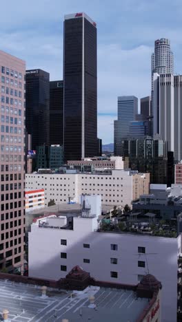 Vertical-Drone-Shot,-Downtown-Los-Angeles-Towers-and-Buildings,-California-USA