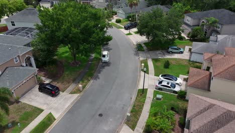 Approaching-drone-shot-of-neat-american-suburb-neighborhood-of-Orlando-City