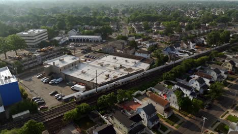 An-aerial-view-of-a-Long-Island-Railroad-train-traveling-on-a-sunny-day