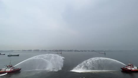 Two-Tugboats-Spraying-Water-Together-Performs-Water-Salute