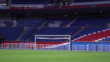 Goal-box-with-folded-net-at-Parc-des-Princes-stadium-home-of-Paris-Saint-Germain-Football-team-showing-Qatar-logo,-Wide-shot