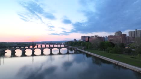 Norfolk-Southern-cargo-train-crossing-Susquehanna-River-at-sunset