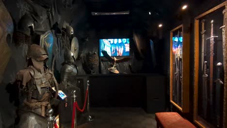 Weta-Cave-museum-and-shop-inside-view-with-knights-armour,-helmets-and-swords-from-films-in-Wellington,-New-Zealand-Aotearoa