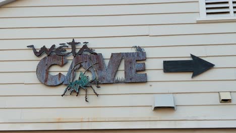 Weta-Cave-sign-and-directional-arrow-at-film-production-workshop-in-Wellington,-New-Zealand-Aotearoa