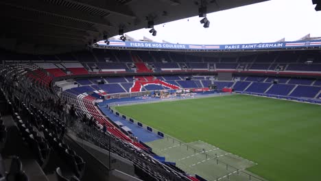 Fans-visit-Soccer-field-stadium-at-Parc-des-Princes-home-of-Paris-Saint-Germain-Football-team,-Aerial-approach-shot