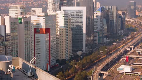 Aerial-view-of-skyscraper-offices-in-Santa-Fe-area-and-highway-in-Mexico-City