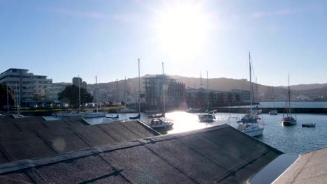 Overlooking-boat-sheds-roofs-at-Chaffers-Marina-and-residential-apartments-and-property-on-Oriental-Parade-in-capital-city-of-Wellington,-New-Zealand-Aotearoa