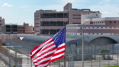 American-flag-waving-in-front-of-high-security-prison