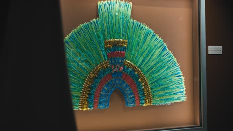 Colorful-feathered-headdress-displayed-in-a-frame-at-the-Zagreb-Chocolate-Museum