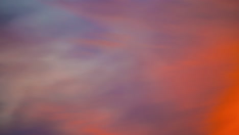 Vibrant-Orange-and-Purple-Sunset-Clouds-in-sky-timelapse