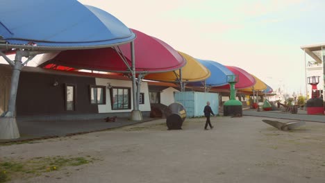 Colorful-canopy-structures-at-La-Rochelle-Maritime-Museum-on-a-bright,-sunny-day