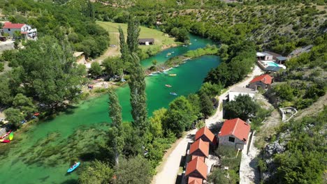 Green-clean-and-clear-river-Zrmanja-meandering-cypresses-and-shrubs-in-cars-landscape-of-Zadar-county