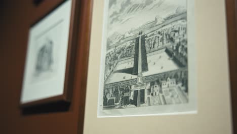 Close-up-of-framed-historical-prints-on-display