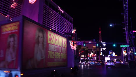 Las-Vegas-USA,-Busy-Night-Traffic-on-Strip-in-Front-of-Flamingo-Casino-Hotel