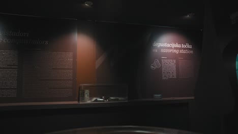 Dimly-lit-savoring-station-with-informational-panels-at-the-Zagreb-Chocolate-Museum