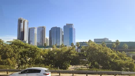 Downtown-Los-Angeles-Skyscrapers-and-Convention-Center,-View-From-Bus-on-Harbor-Freeway,-California-USA