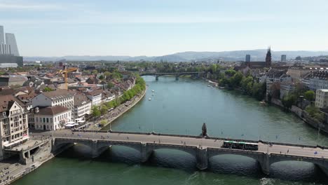 Drone-Shot-Of-Suspended-Unique-Basel-Bridge-Over-Water-Canal,-Switzerland