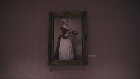 Framed-portrait-of-a-woman-holding-a-tray-of-chocolate-drinks-on-display-at-the-Zagreb-Chocolate-Museum