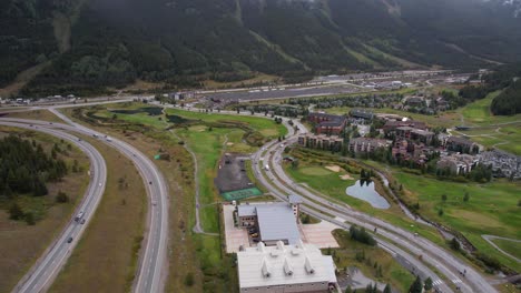 Copper-Mountain-Ski-Resort-and-Interstate-70-Highway-Traffic,-Colorado-USA,-Revealing-Drone-Shot