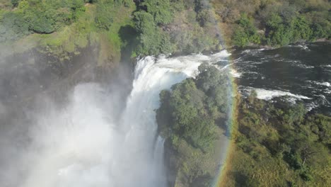 Aerial-Drone-View-Of-Victoria-Falls-And-Its-Rainbows,-In-Between-Zambia-And-Zimbabwe