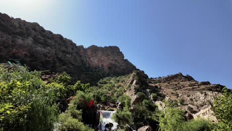 Bekhal-waterfall-flowing-out-of-the-mountain-on-a-crowded-summer-day