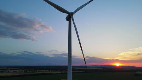 Sunset-with-wind-turbine,-drone-footage