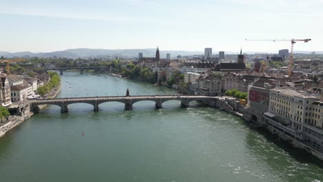 Aerial-Shot-Of-Suspended-Unique-Basel-Bridge-Over-Water-Canal,-Switzerland