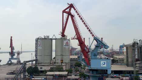 View-Of-High-Factories-Structure-And-Tower-Cranes-At-Industrial-Area-Of-Tanjung-Priok-Port