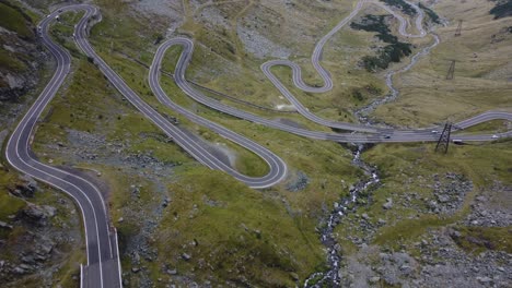 Scenic-aerial-view-over-the-dramatic-switchbacks-of-the-Transfagarasan-mountain-road-in-the-Carpathians,-Romania